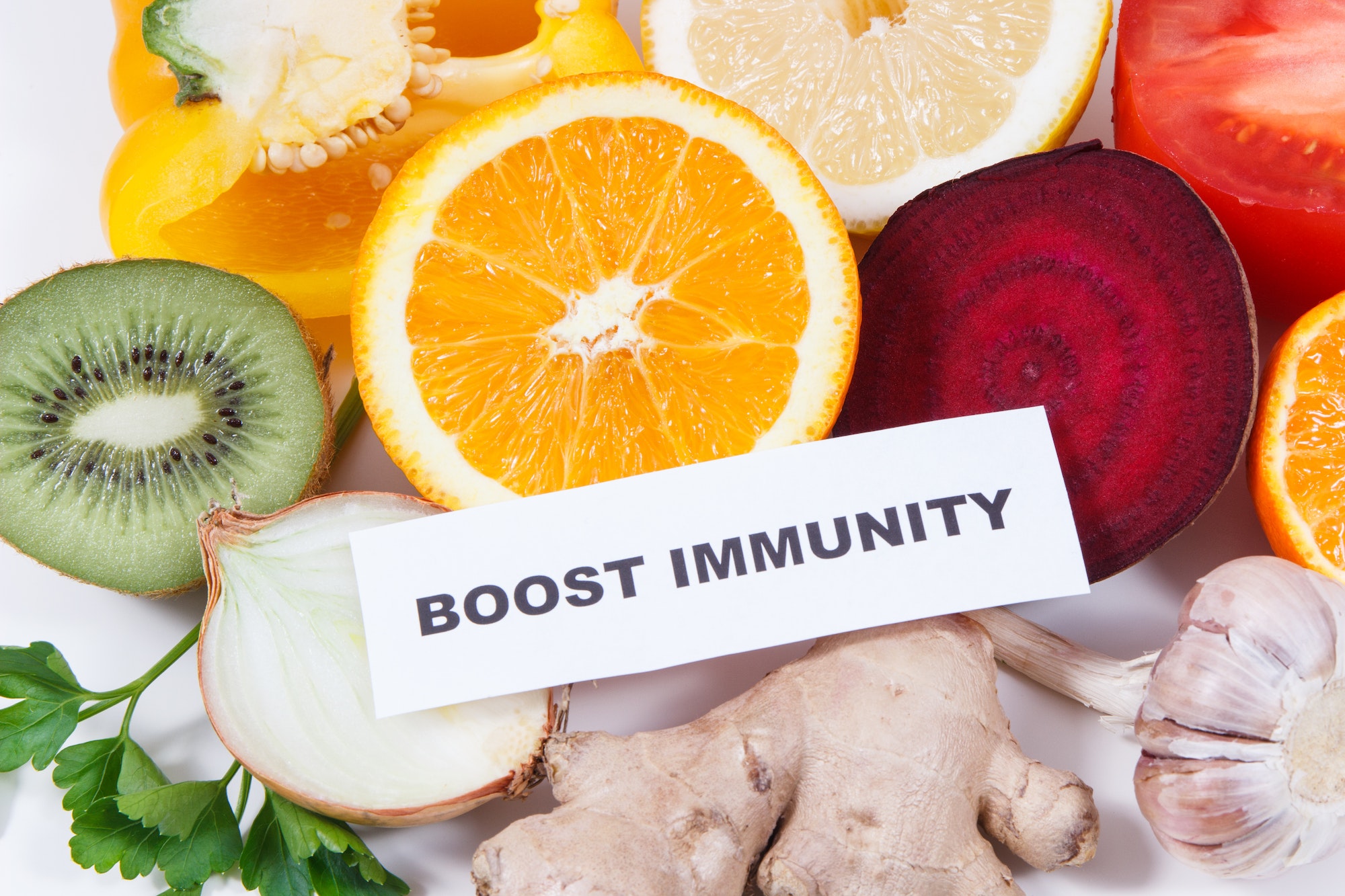 Inscription boost immunity, fresh healthy fruits and vegetables containing vitamins